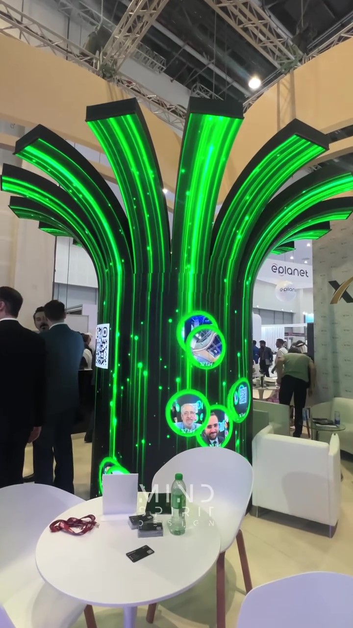 Interactive digital wishing tree displaying attendee messages on a large screen