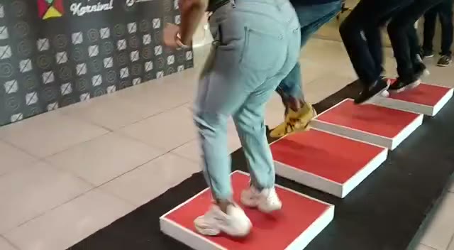 Weight stepping game with sensor mat at a corporate wellness day
